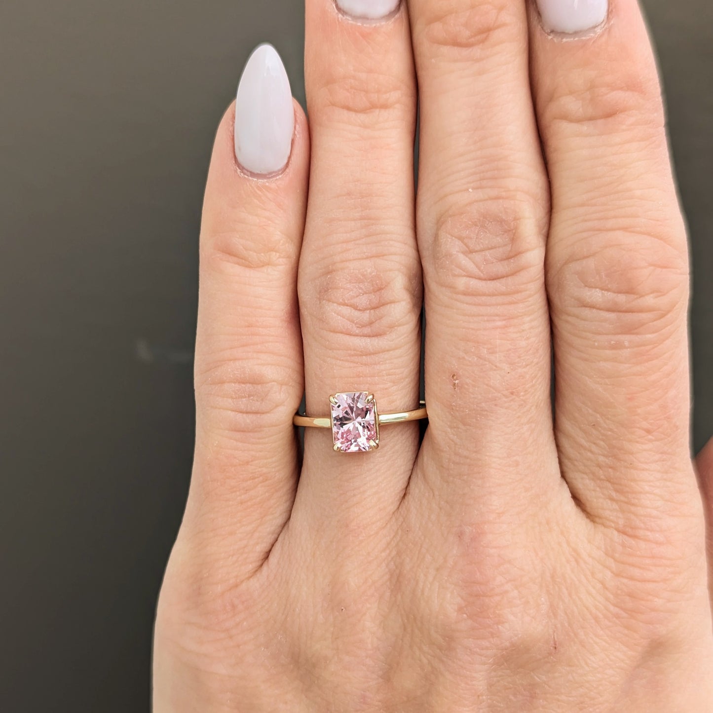 Adrienne solitaire engagement ring with radiant lab sapphire