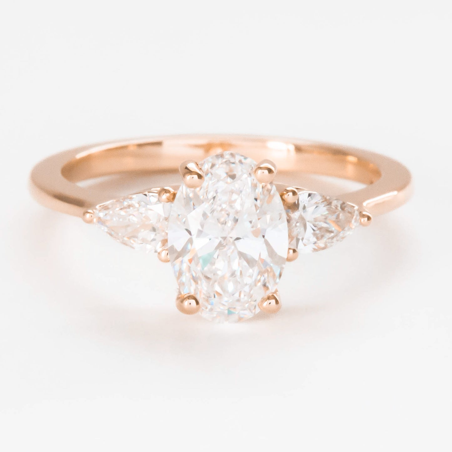 Beckett engagement ring with oval and pear lab diamonds