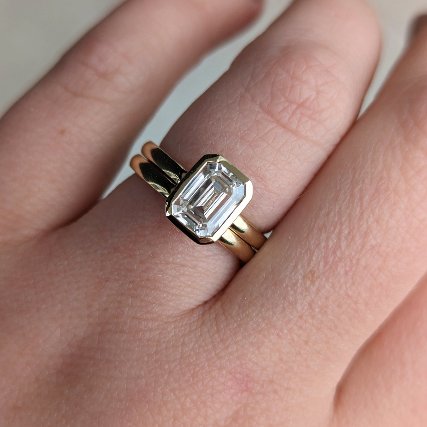 Cami solitaire engagement ring with step cut lab sapphire