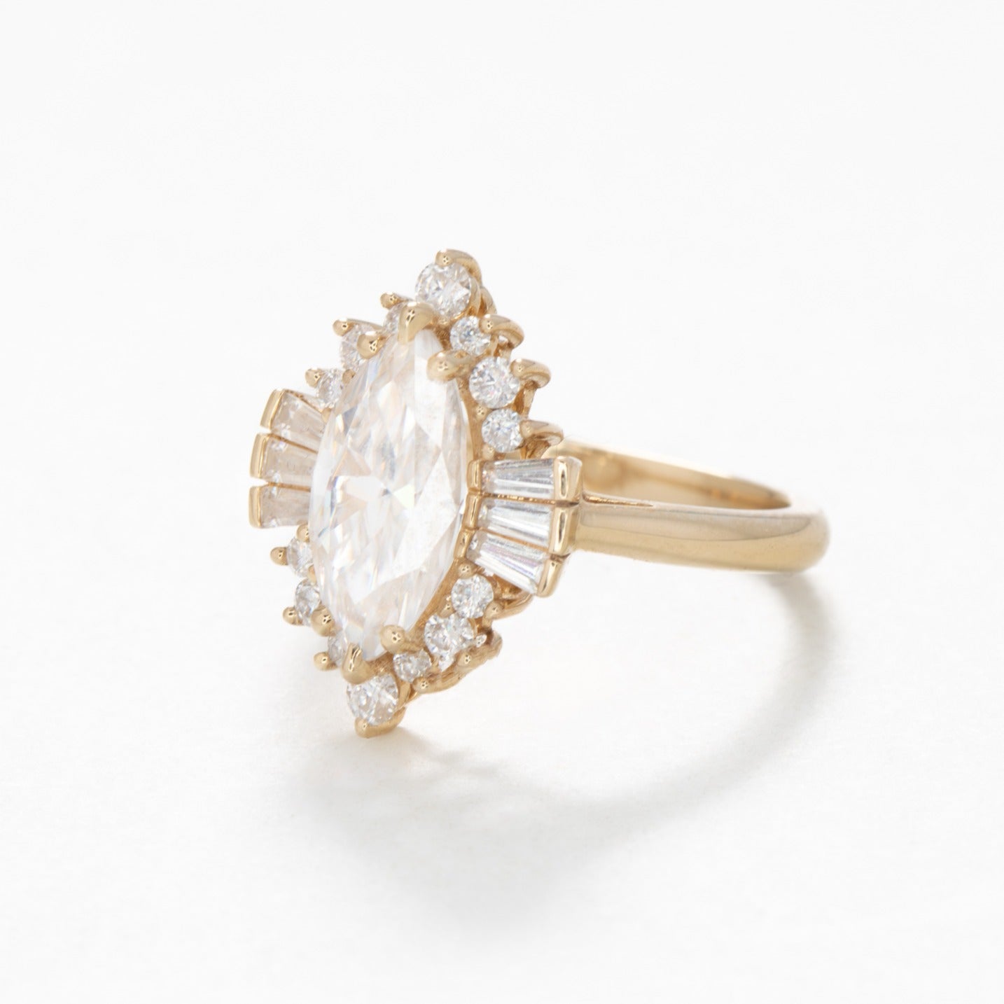 Celeste halo engagement ring with marquise moissanite
