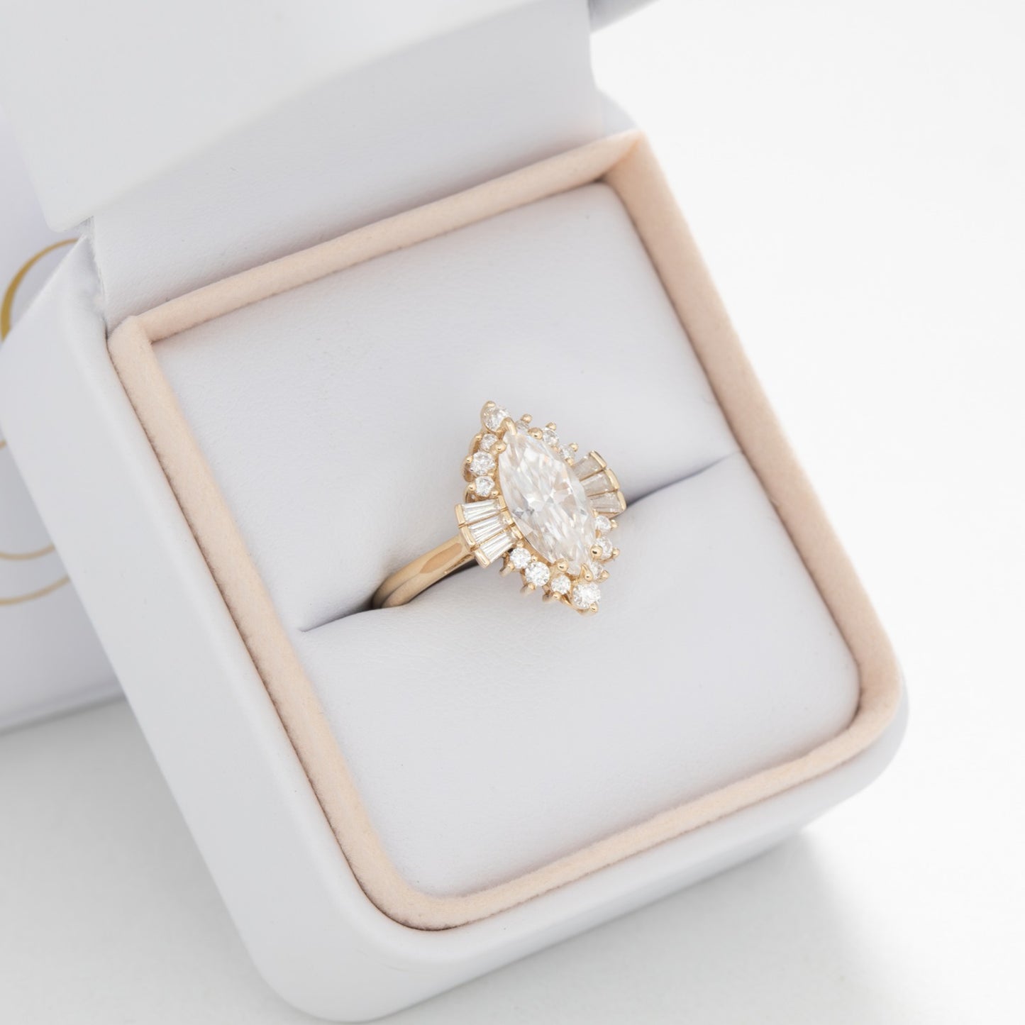Celeste halo engagement ring with marquise moissanite