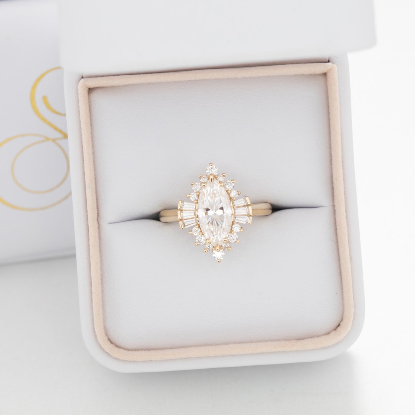 Celeste halo engagement ring with marquise moissanite