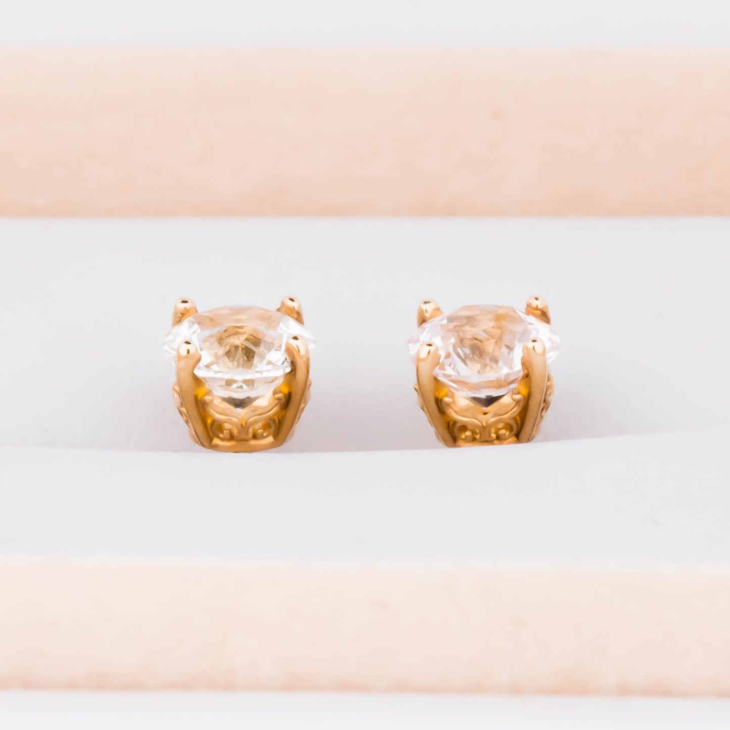 white lab sapphire earrings in yellow gold
