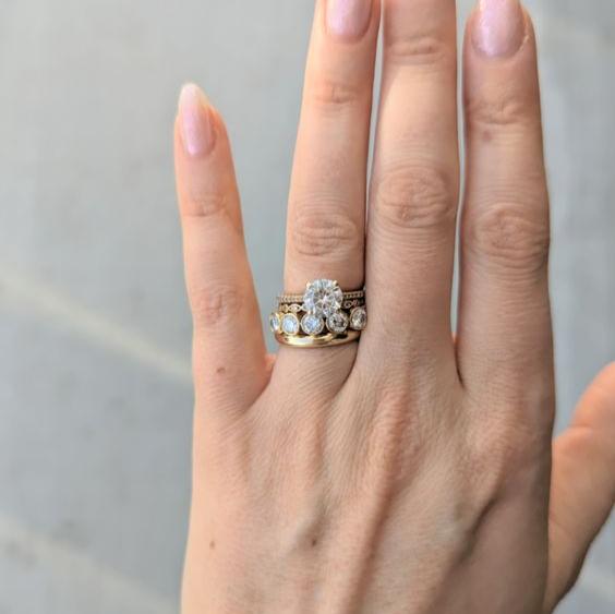 yellow gold stacking bands with round moissanitess