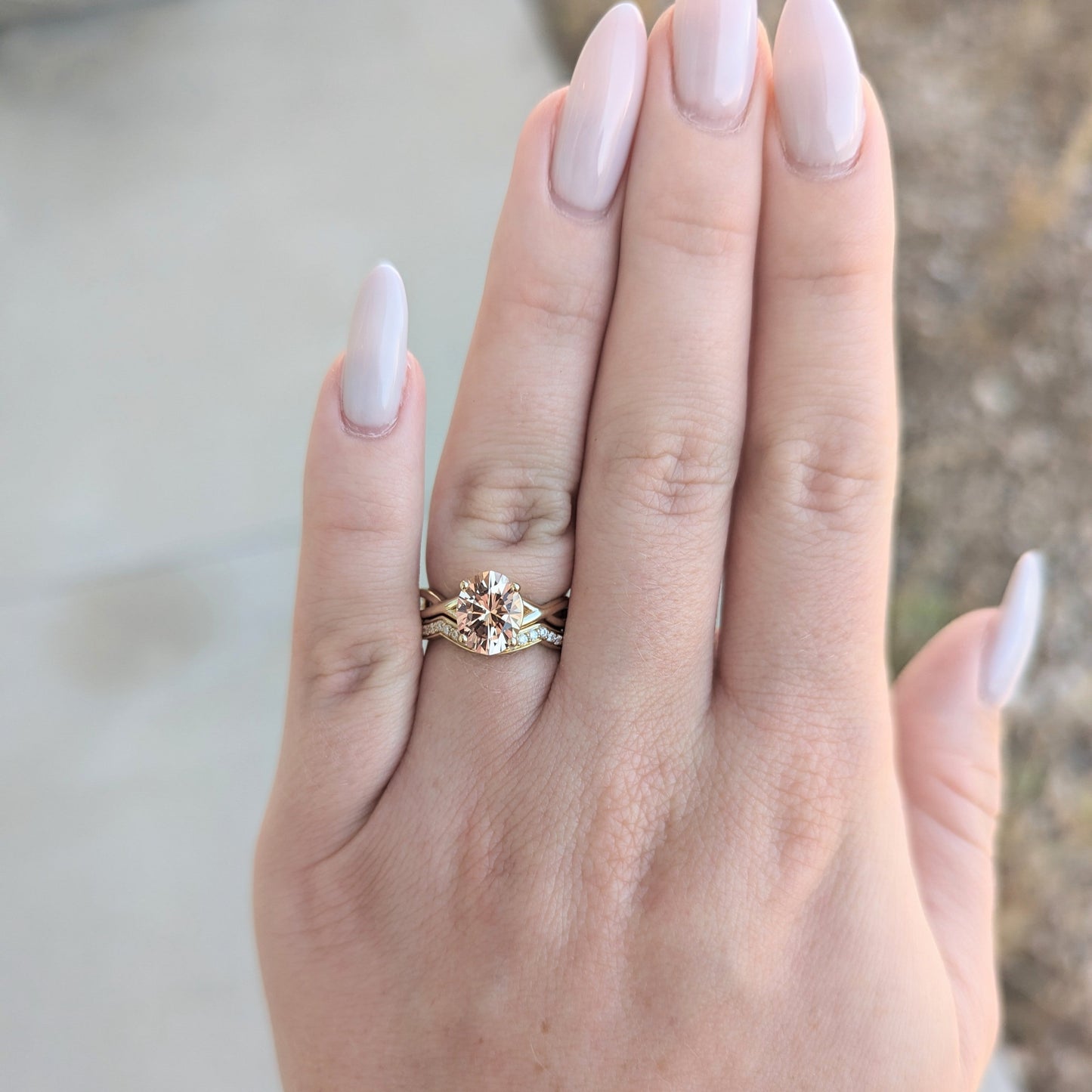 Fifer solitaire engagement ring with peach oval lab sapphire