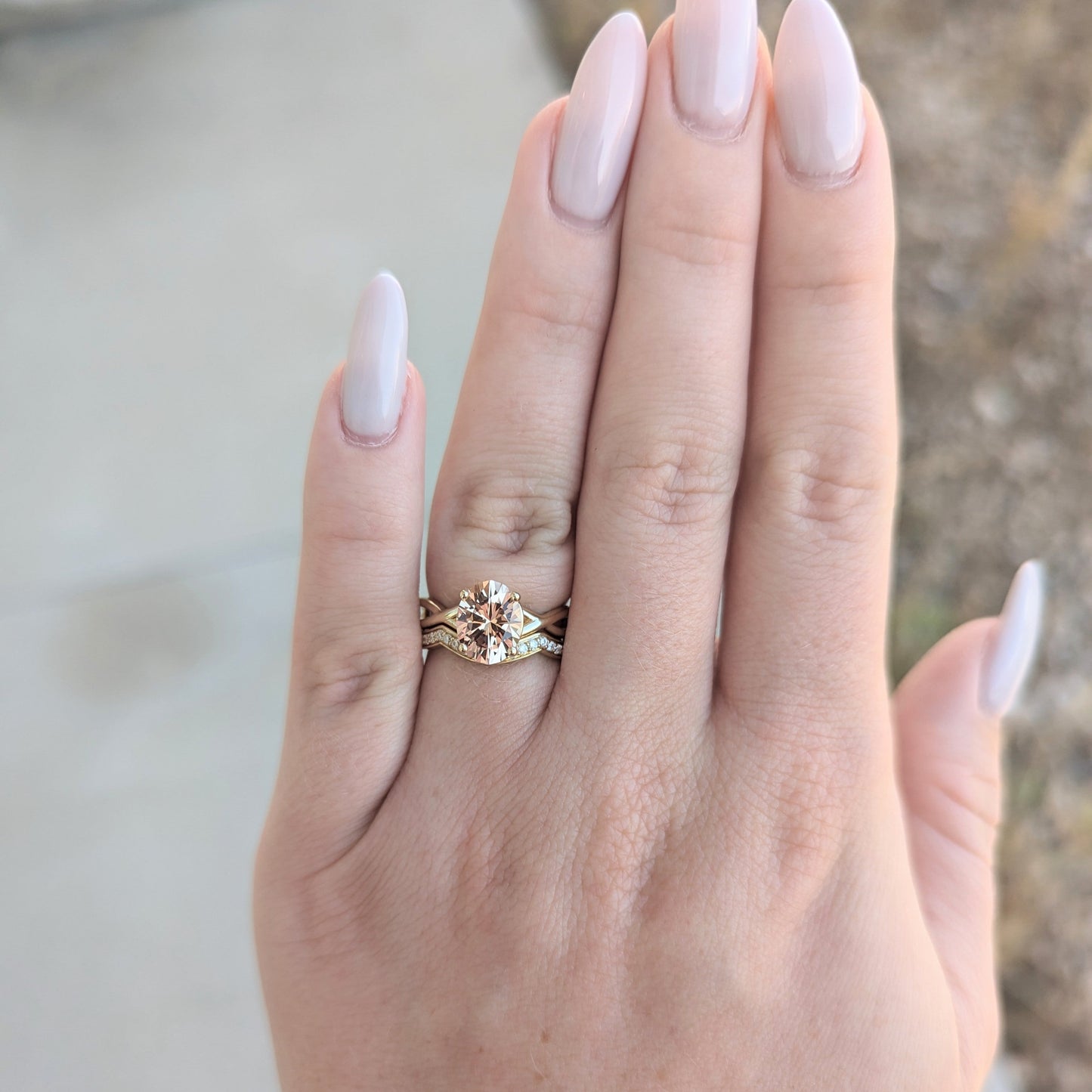 yellow gold wedding set with peach oval lab sapphire