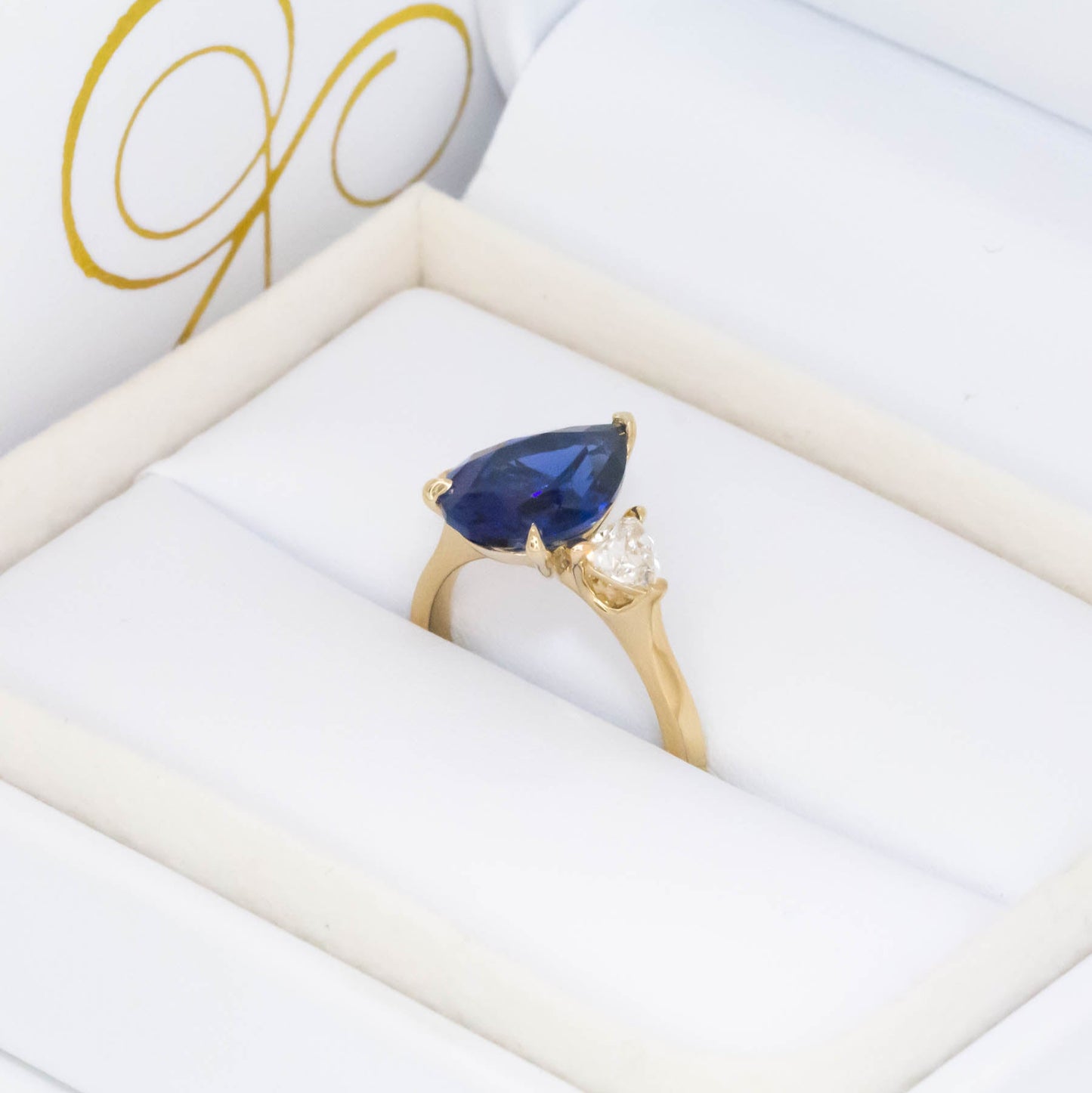 Fiona three stone engagement ring with blue lab sapphire pear