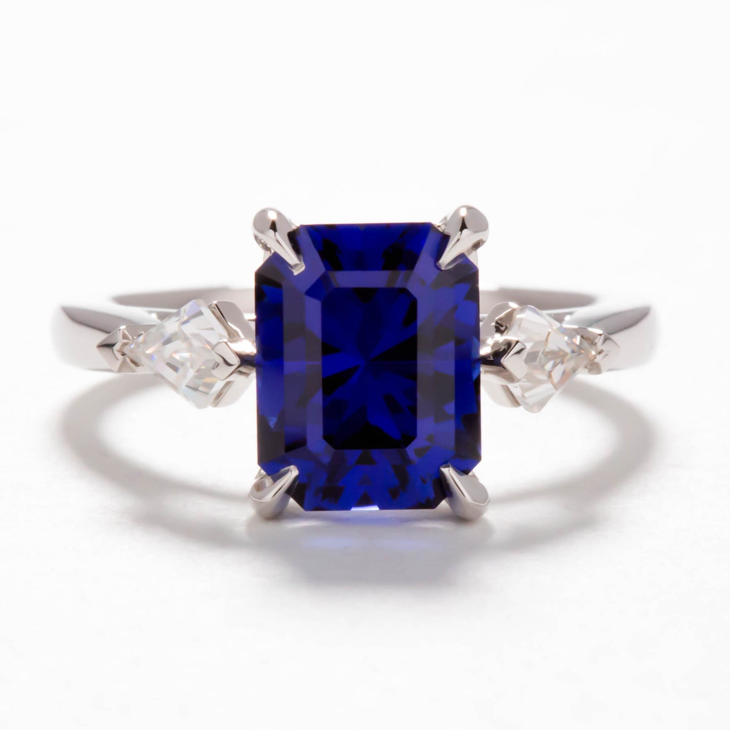 Jamie three stone engagement ring with step cut lab sapphire