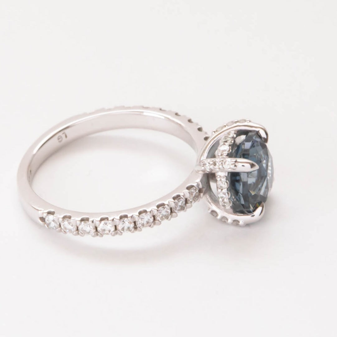 Janja light blue hidden halo engagement ring