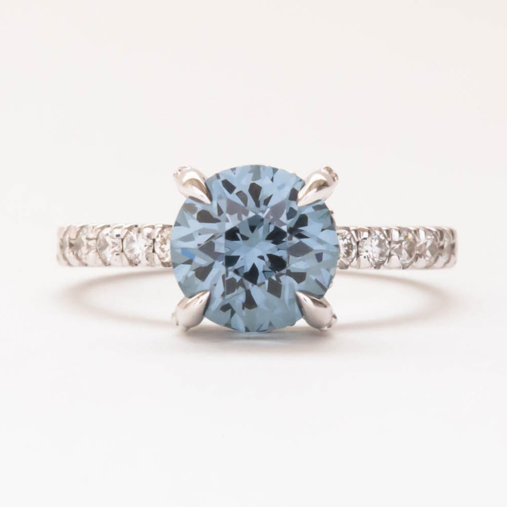 Janja light blue hidden halo engagement ring