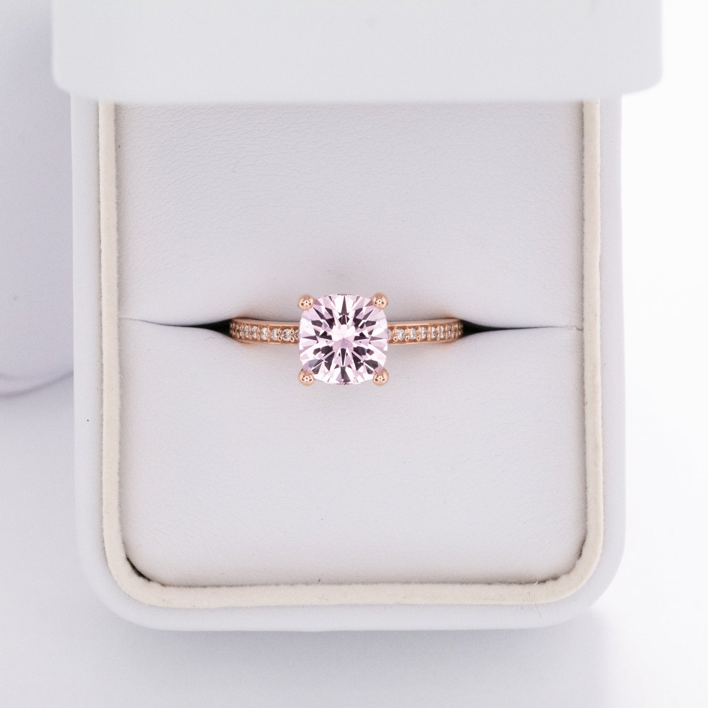Kira hidden halo engagement ring with peach lab sapphire cushion