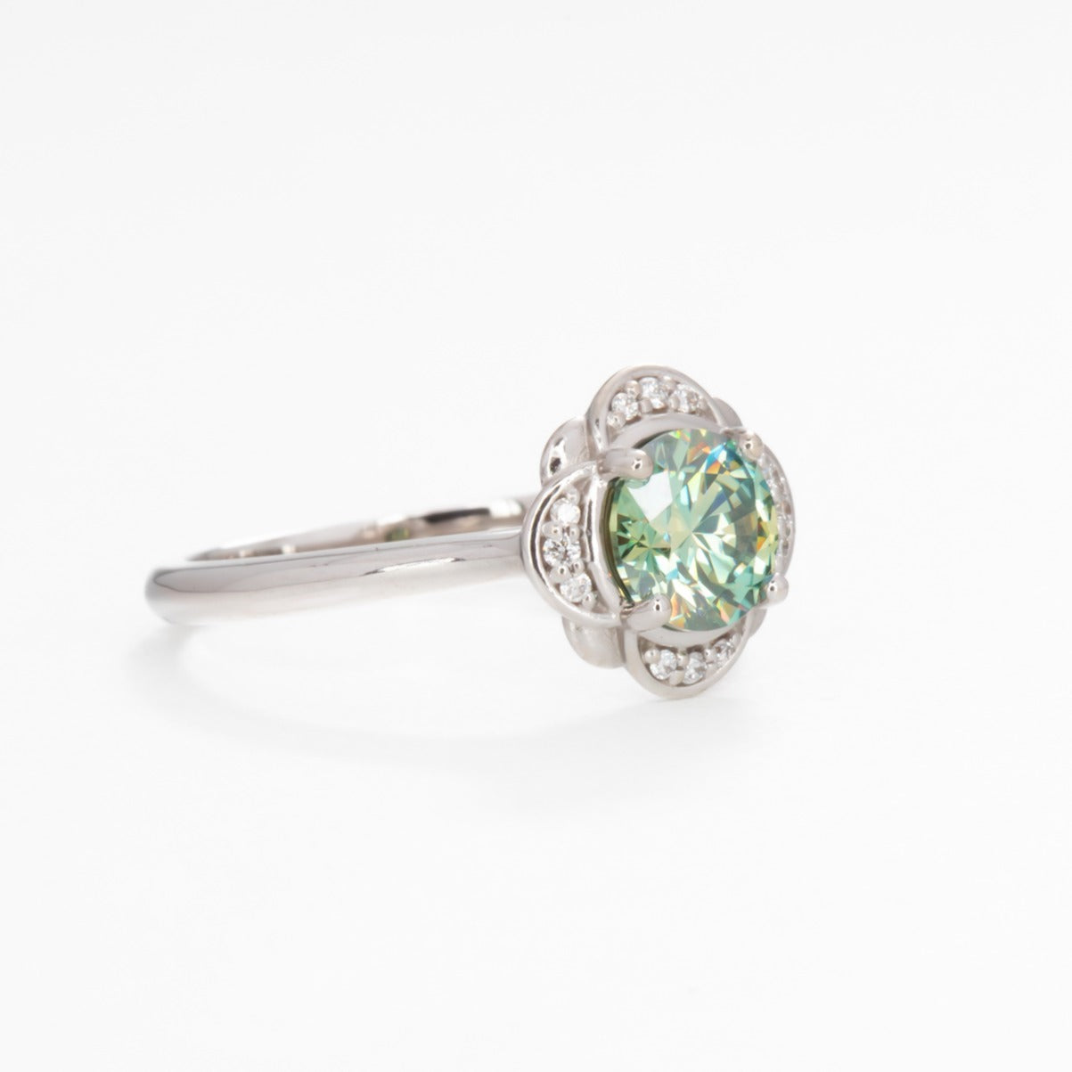 Lalita halo nature inspired engagement ring with teal moissanite