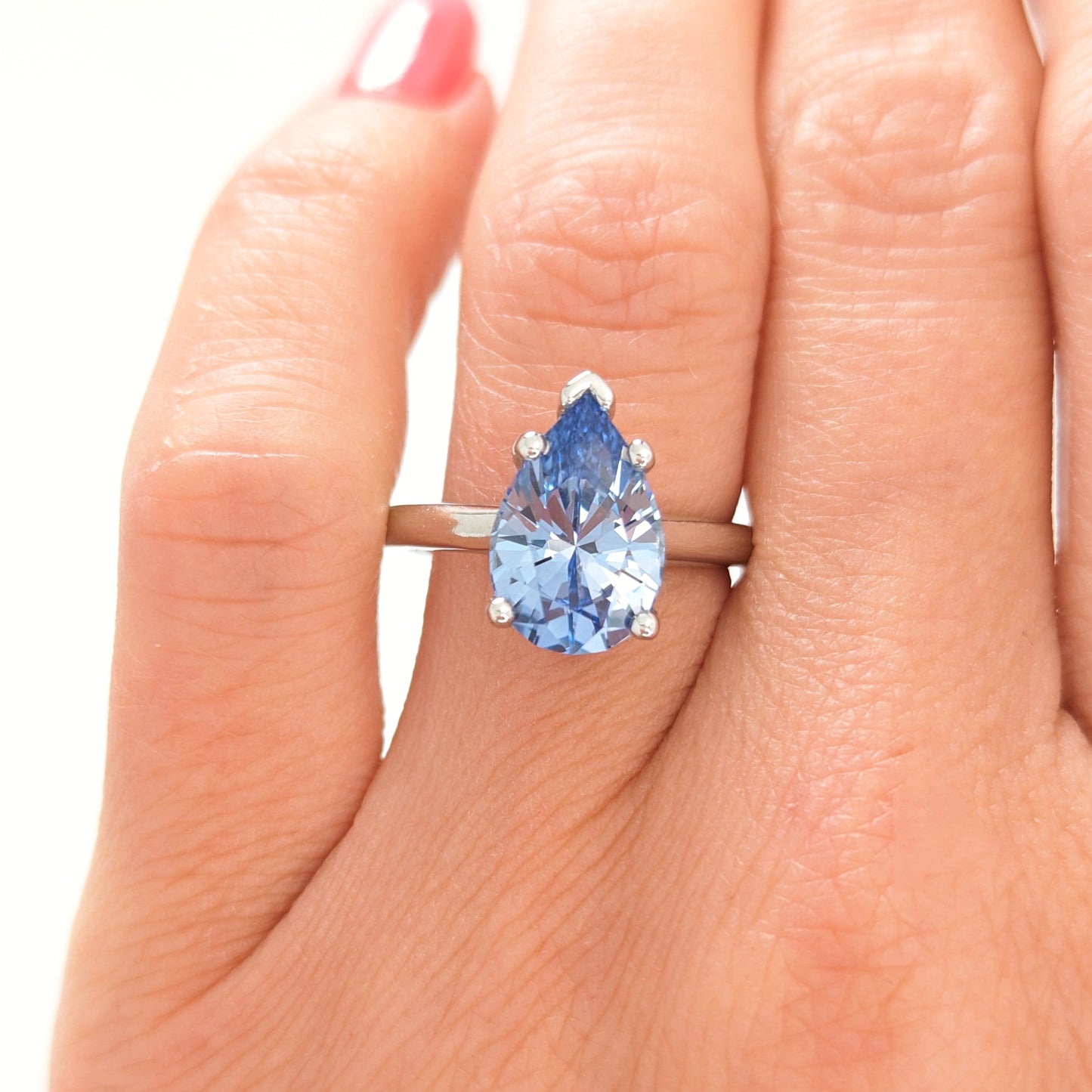 Liv engagement ring with pear blue lab sapphire