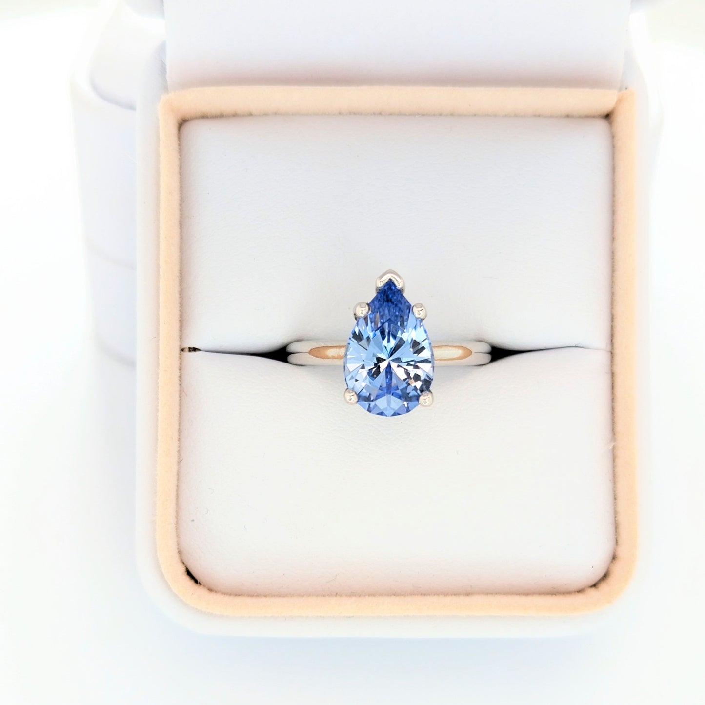 Liv engagement ring with pear blue lab sapphire