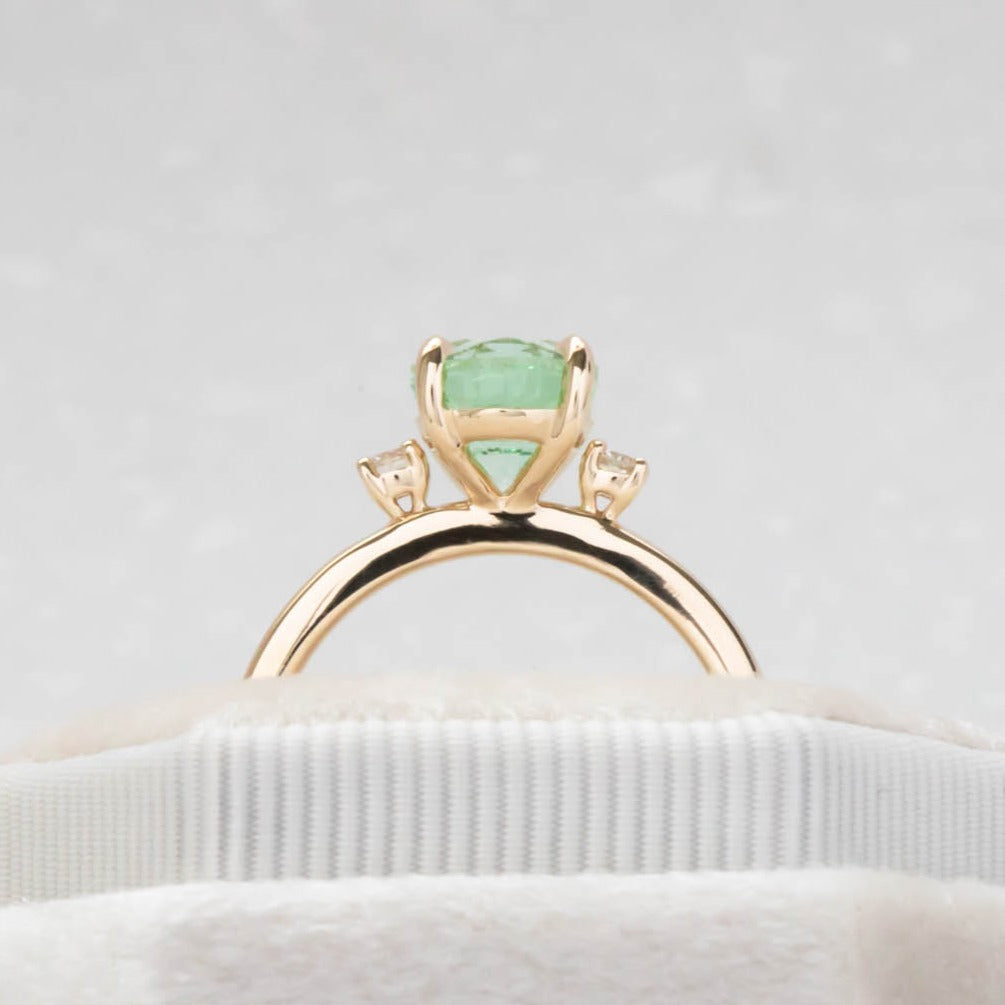 Naomi engagement ring with oval green lab sapphire