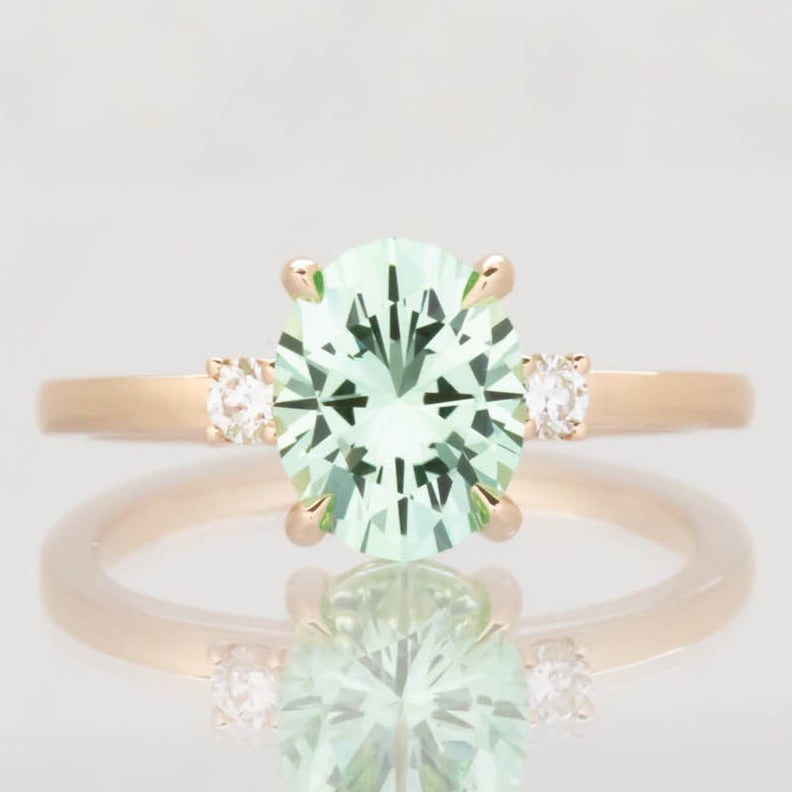 Naomi engagement ring with oval green lab sapphire