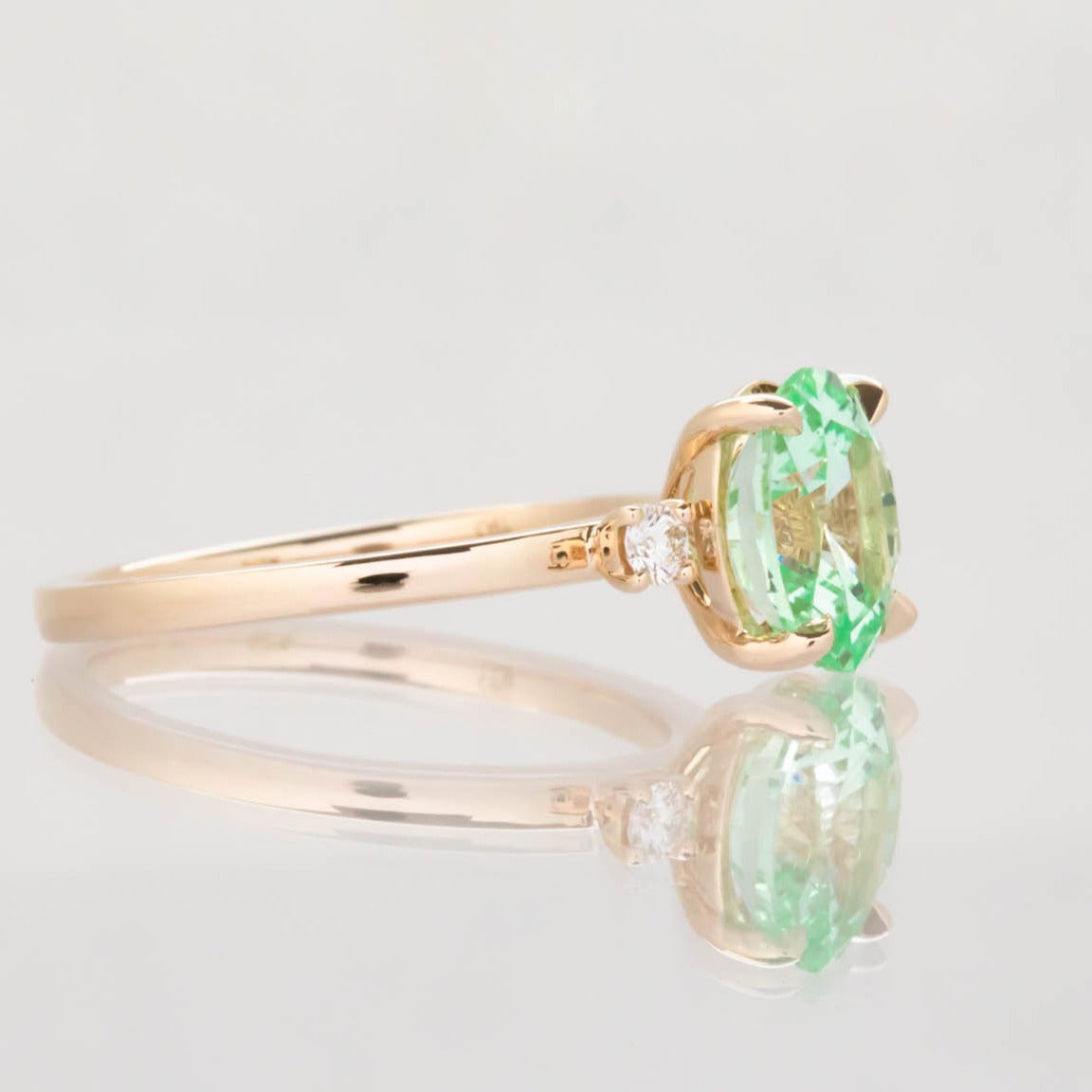 Naomi engagement ring with oval green lab sapphire