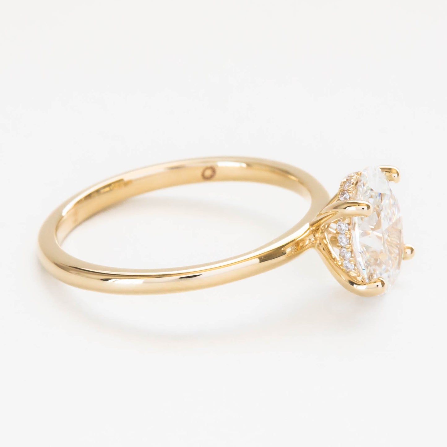Oval lab diamond hidden halo engagement ring
