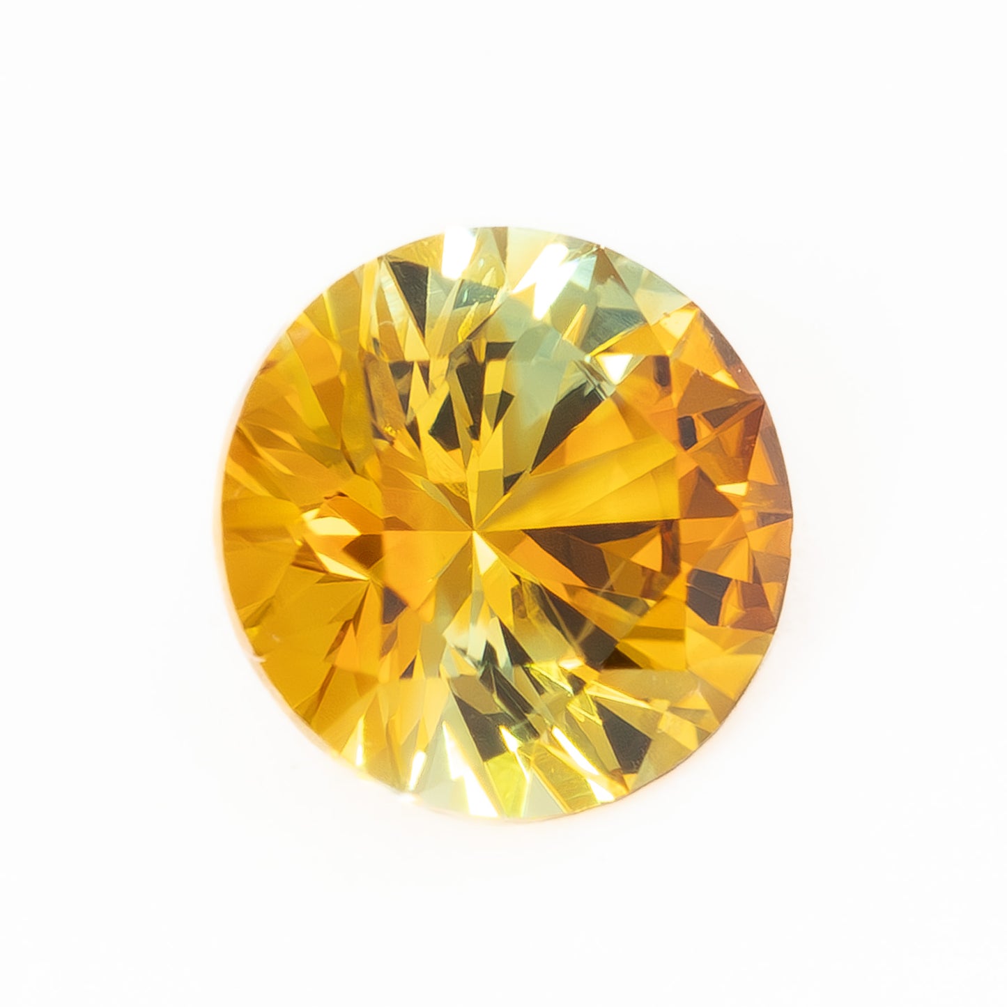 PSH0507 0.77ct parti color orange and yellow round brilliant montana sapphire