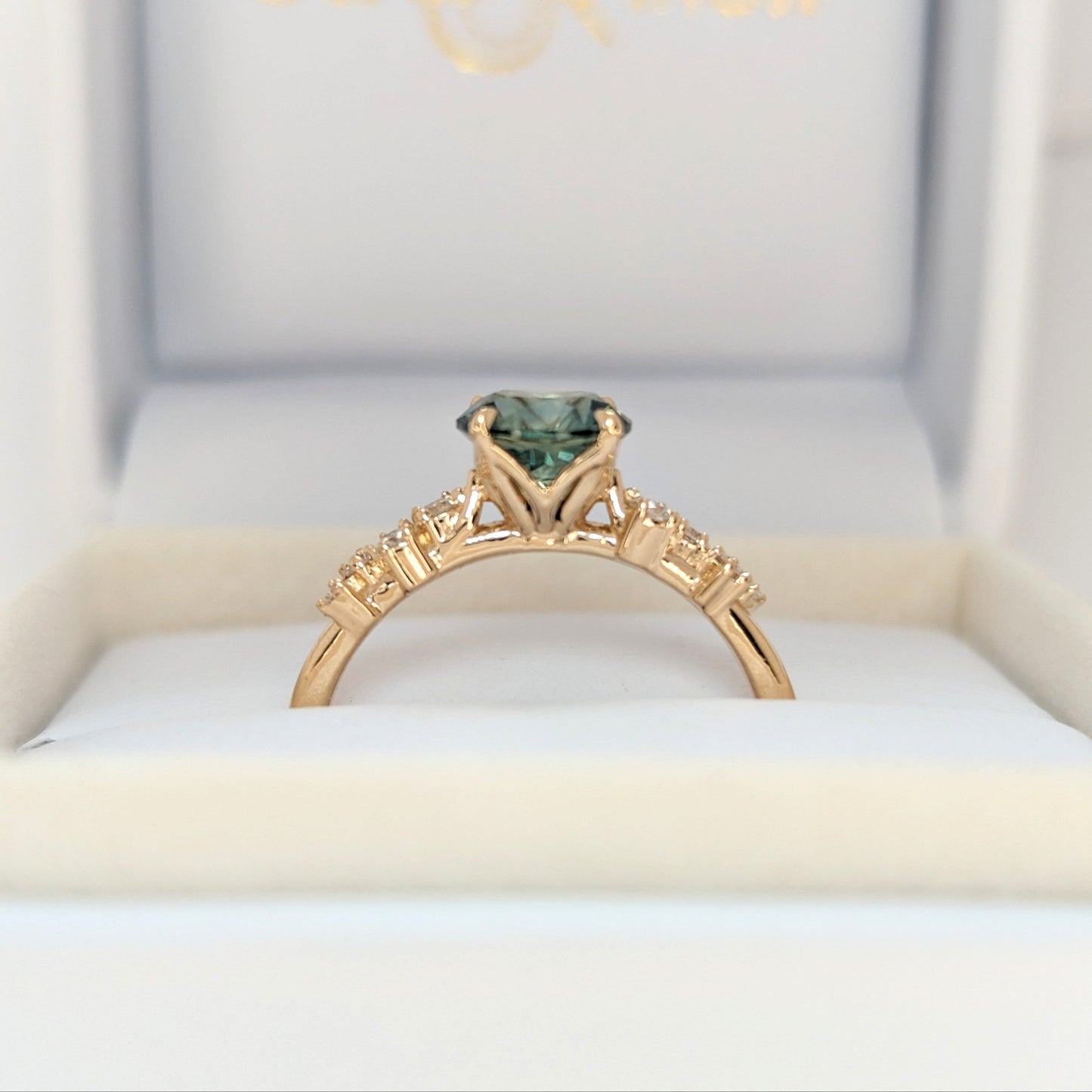 Penolope engagement ring with round sapphire