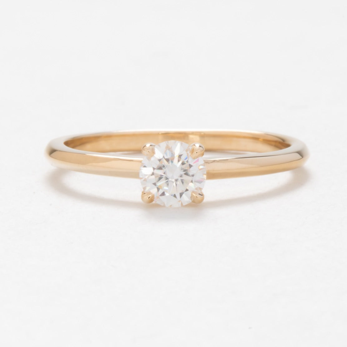 Petite solitaire engagement ring with moissanite