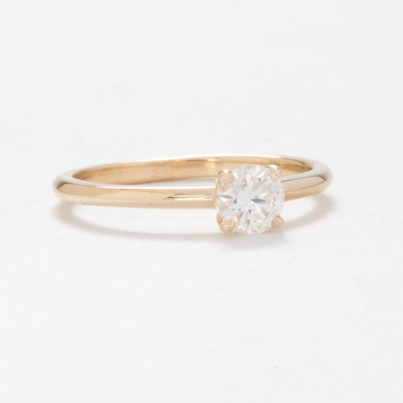 Petite solitaire engagement ring with moissanite