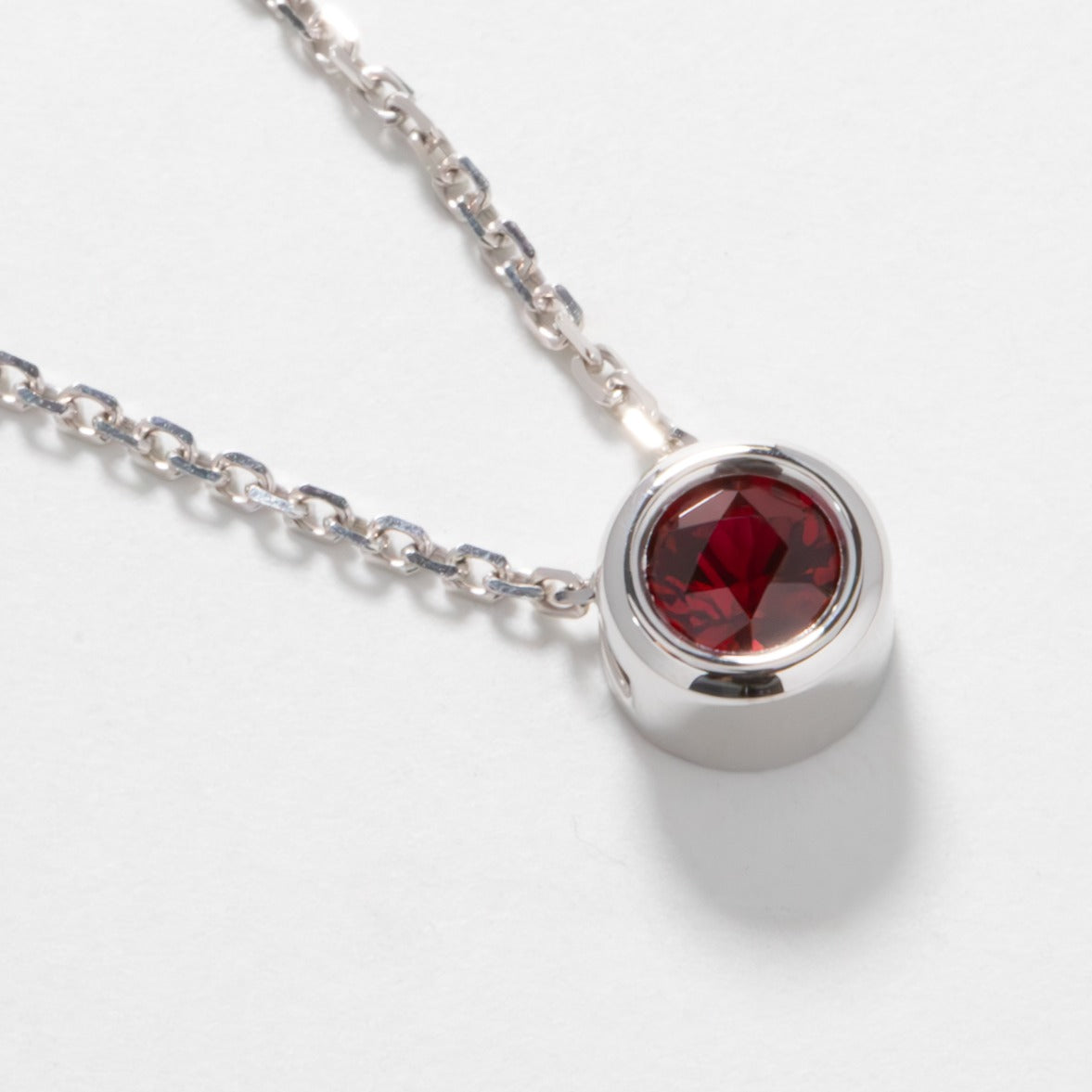 Rhea necklace in white gold with lab ruby