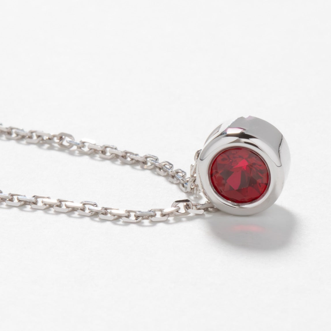 Rhea necklace in white gold with lab ruby
