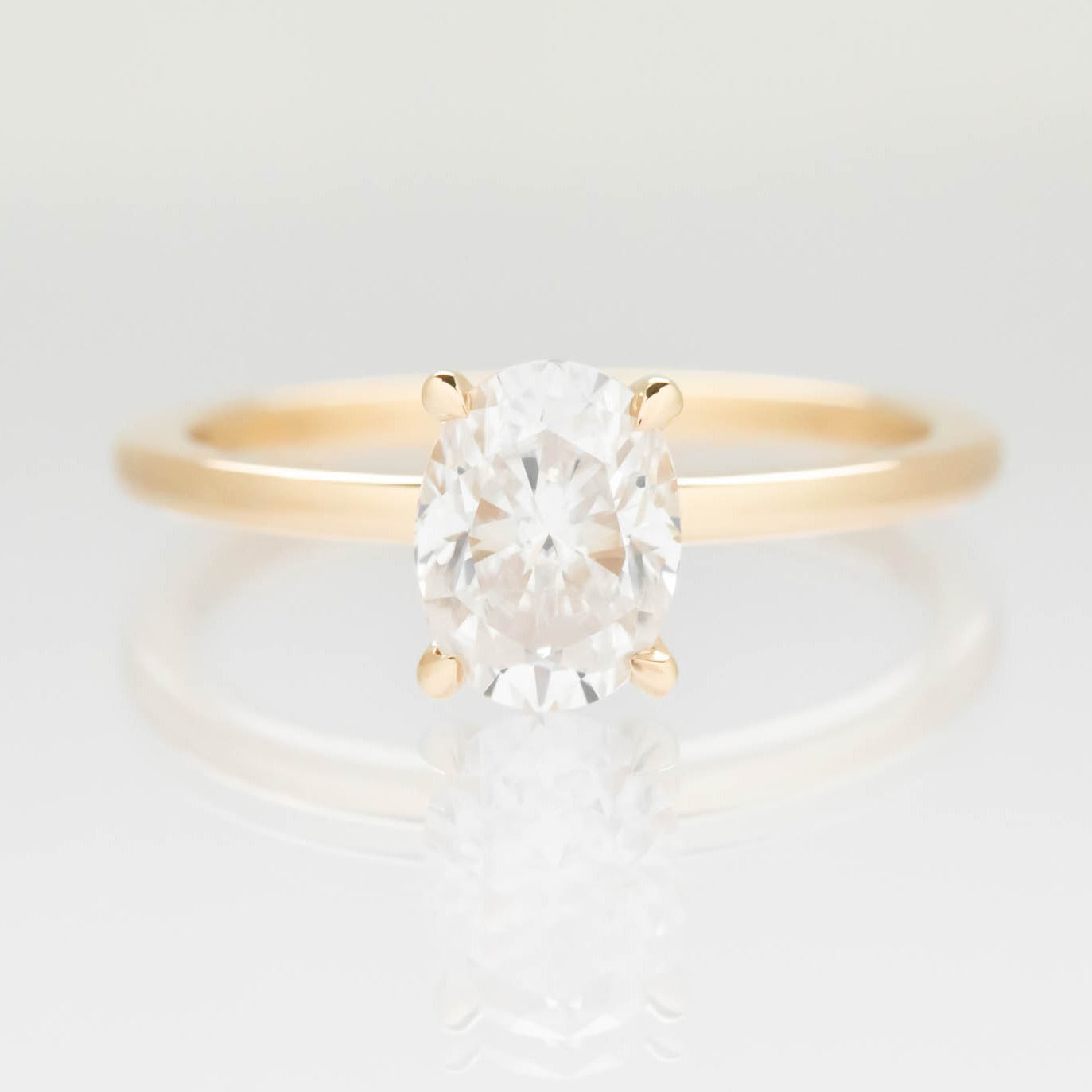 Serene solitaire engagement ring with oval moissanite