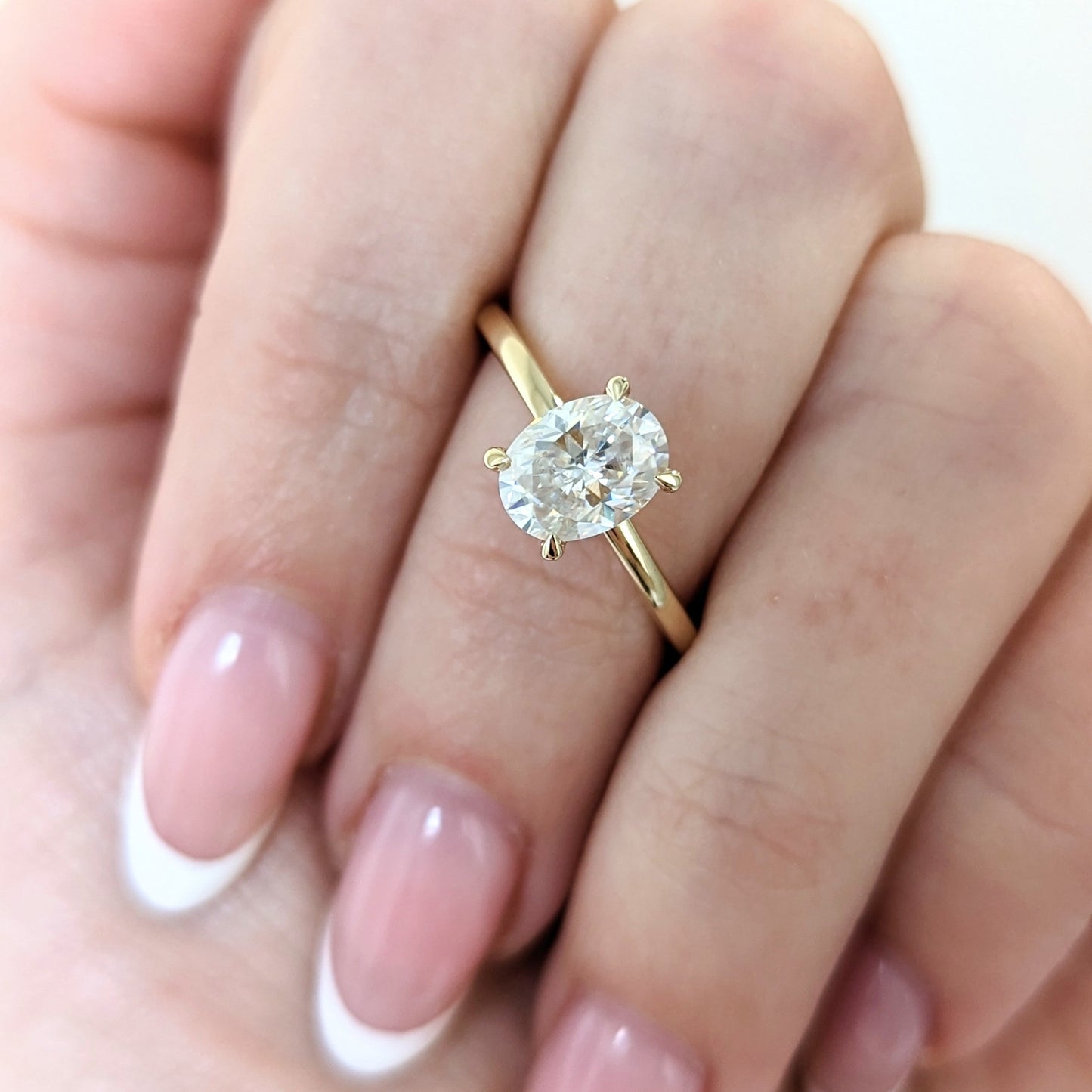 Serene solitaire engagement ring with oval moissanite