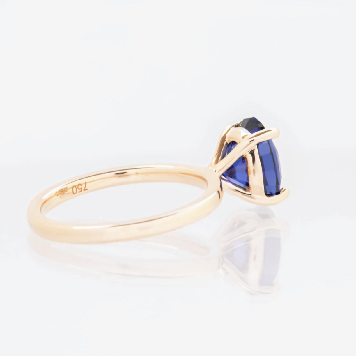 Serene solitaire engagement ring with oval blue lab sapphire