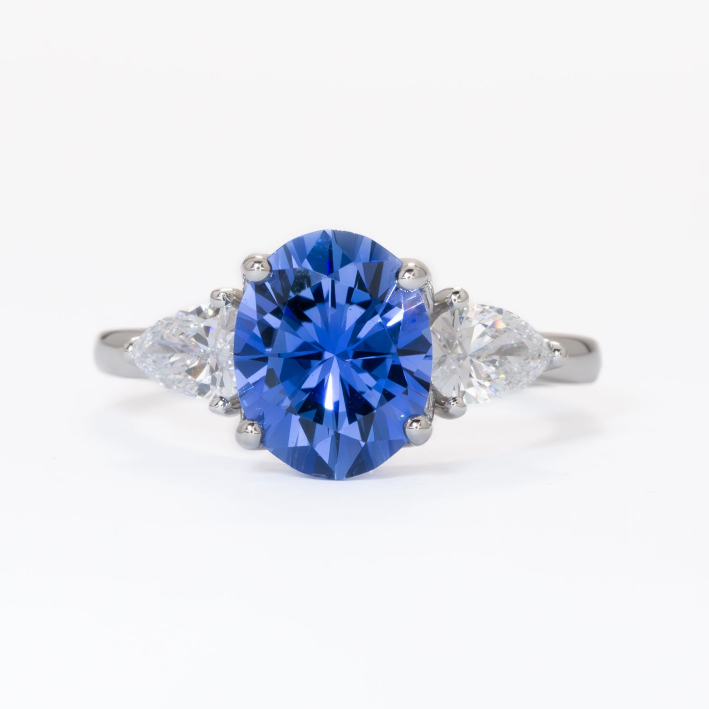 Tawnee three stone engagement ring with oval lab sapphire