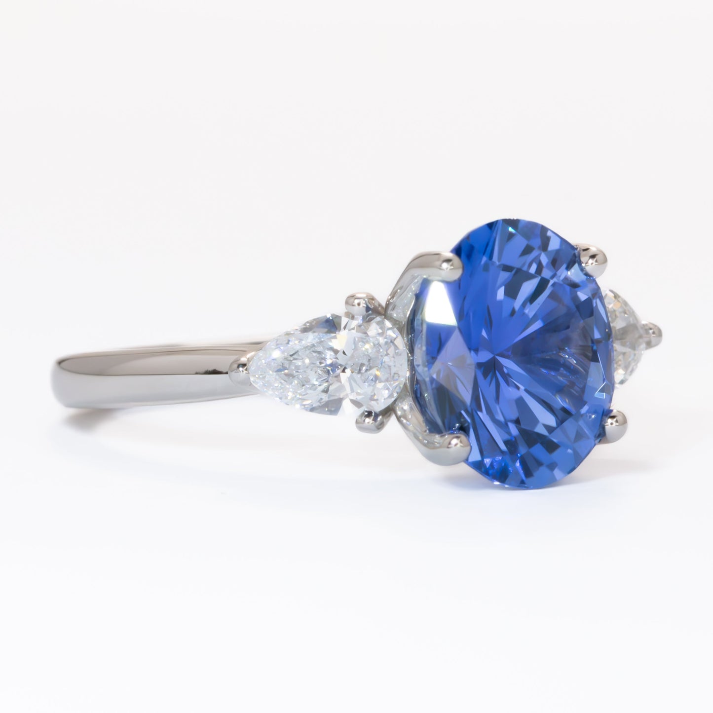 Tawnee three stone engagement ring with oval lab sapphire