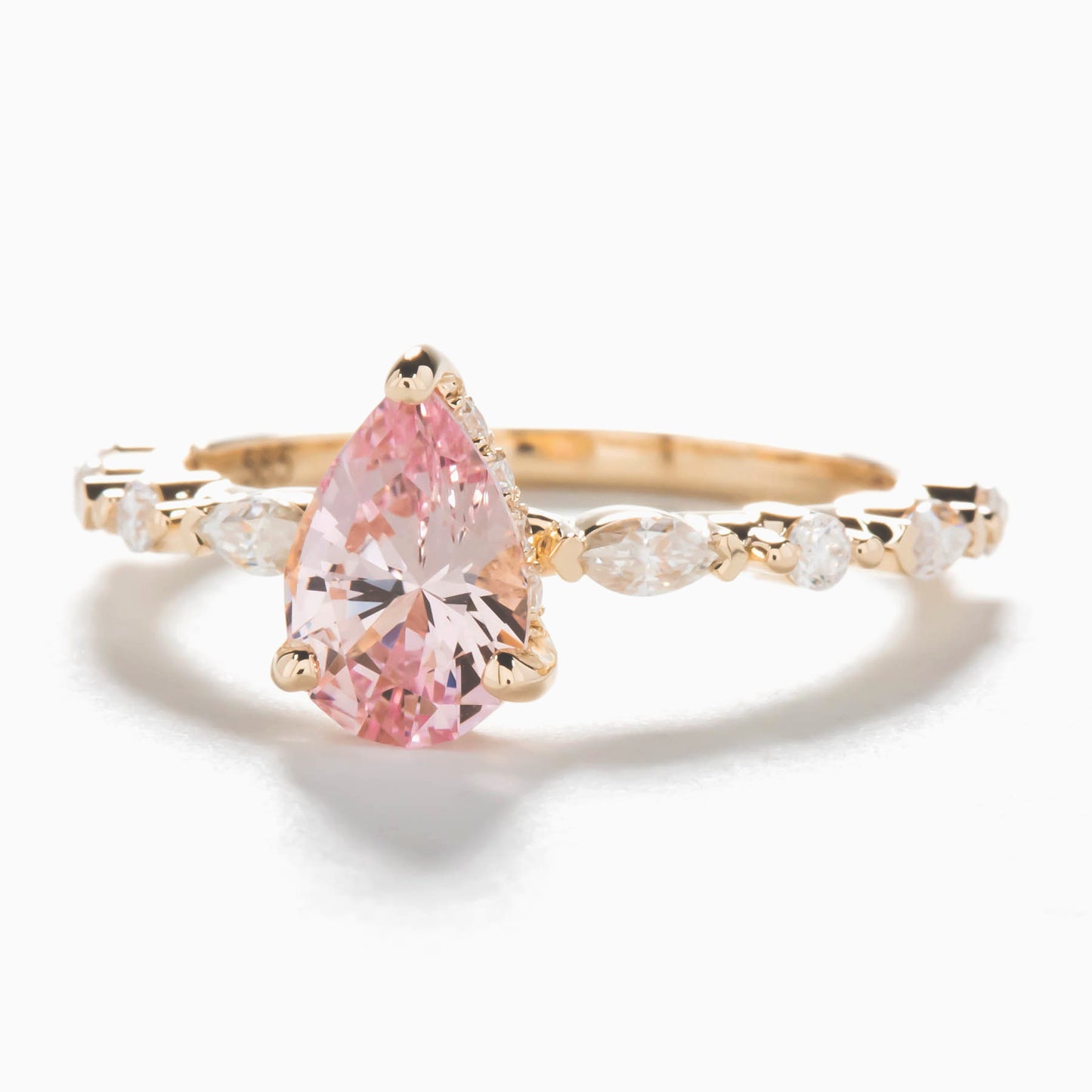 peach lab sapphire pear engagement ring with moissanite