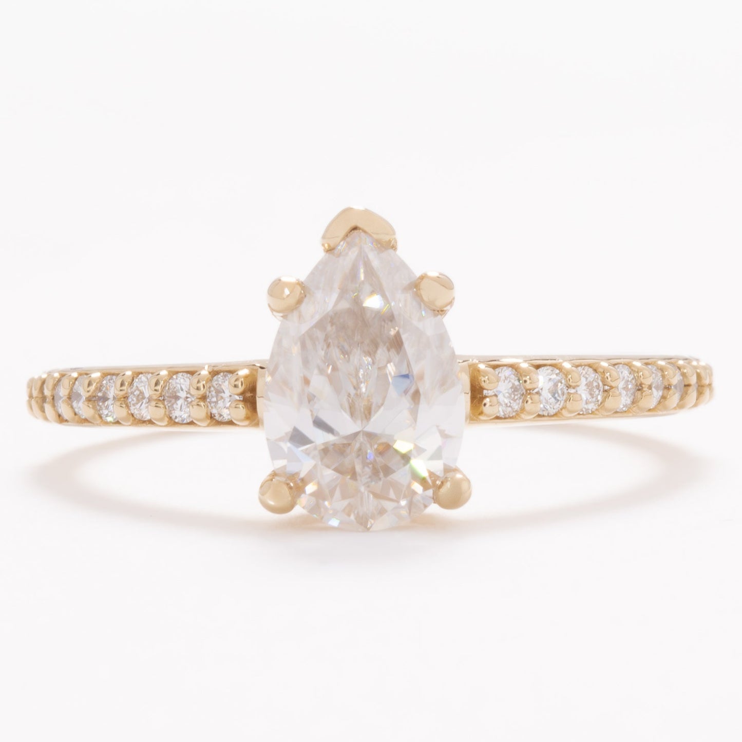 accented liv engagement ring with pear moissanite