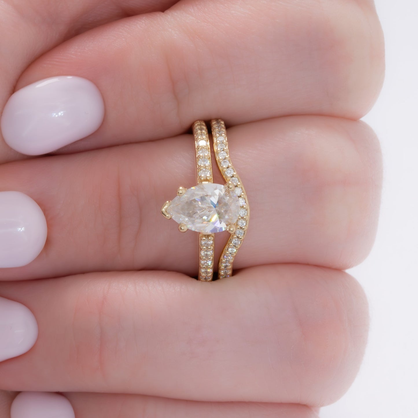 accented liv engagement ring with pear moissanite