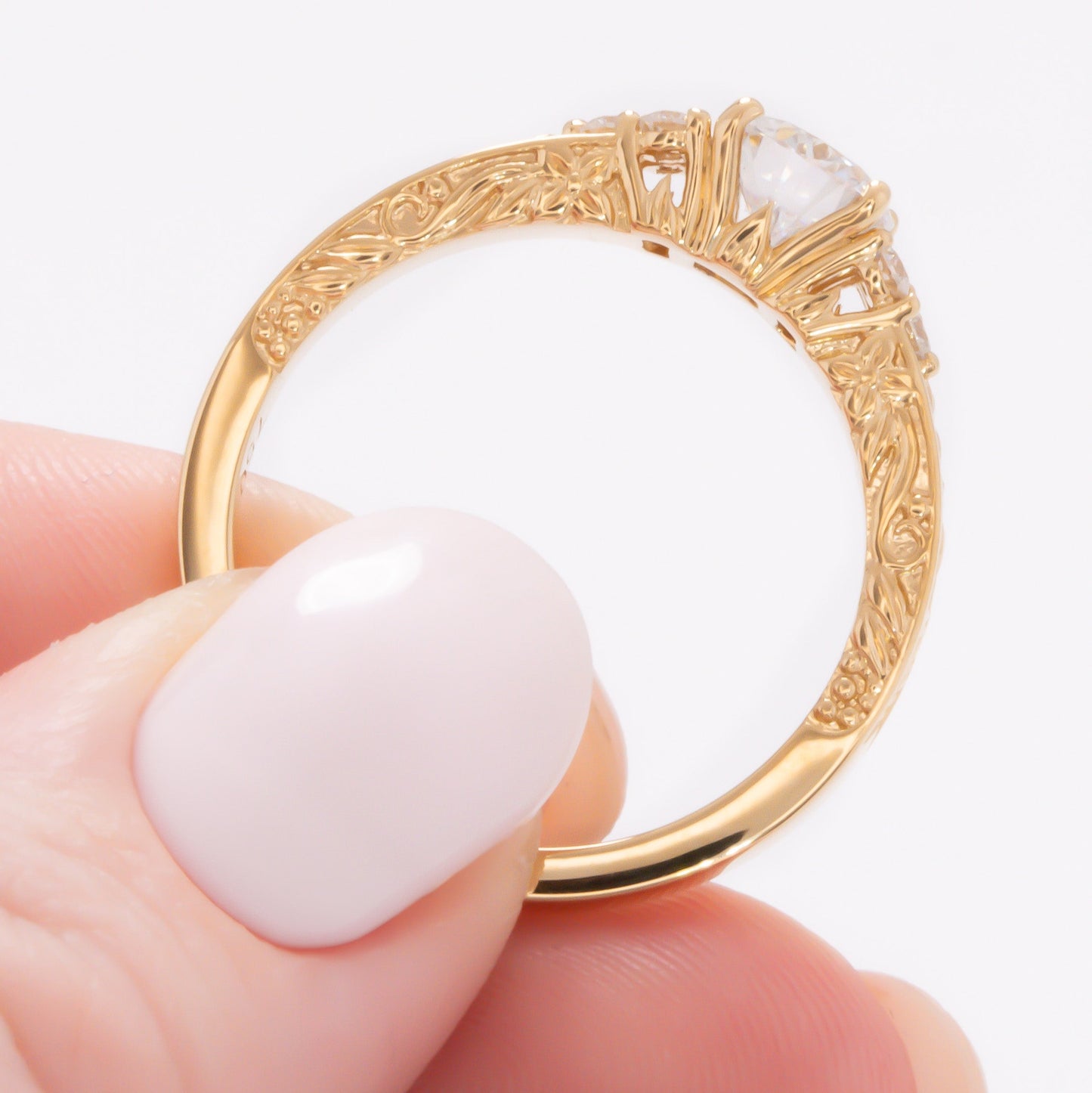 alice ring in yellow gold with round moissanite
