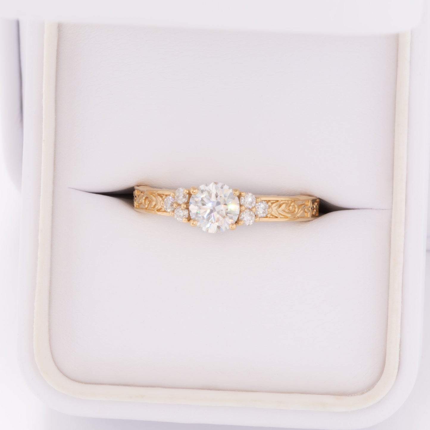alice ring in yellow gold with round moissanite