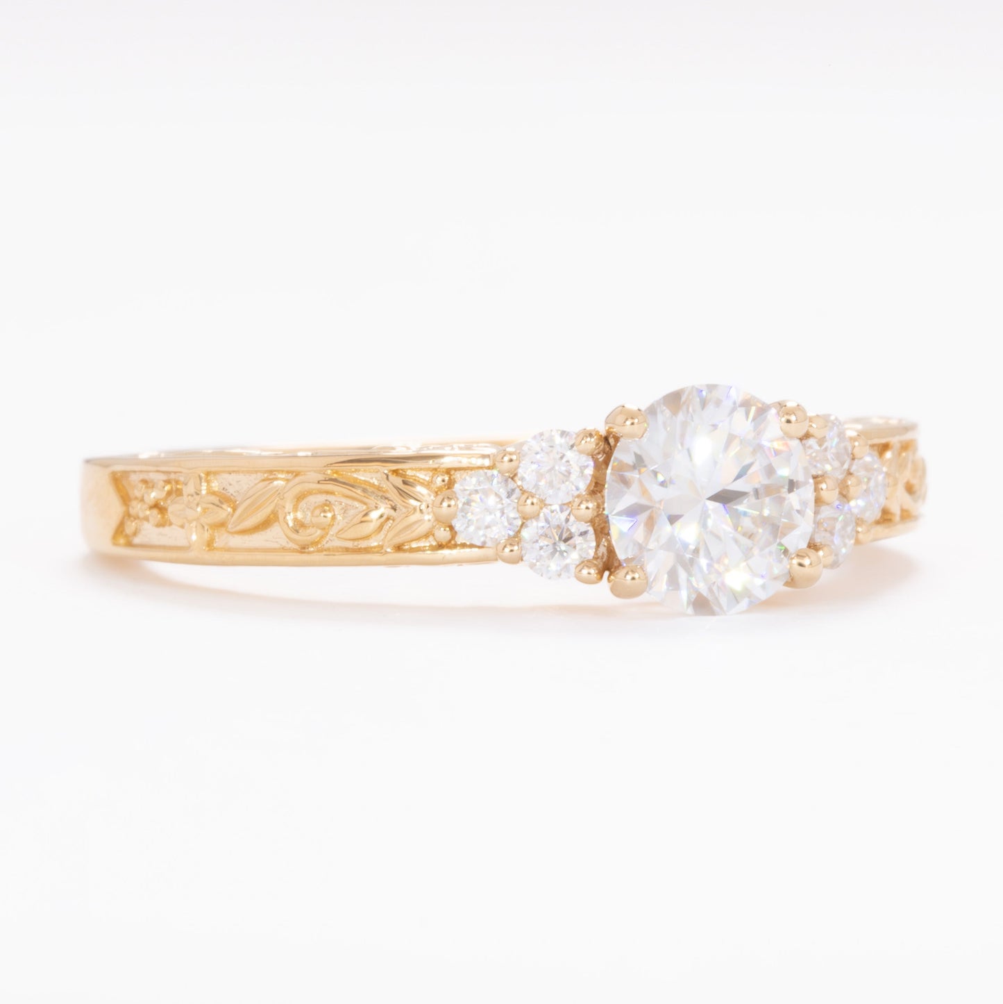 alice ring in yellow gold with round moissanite