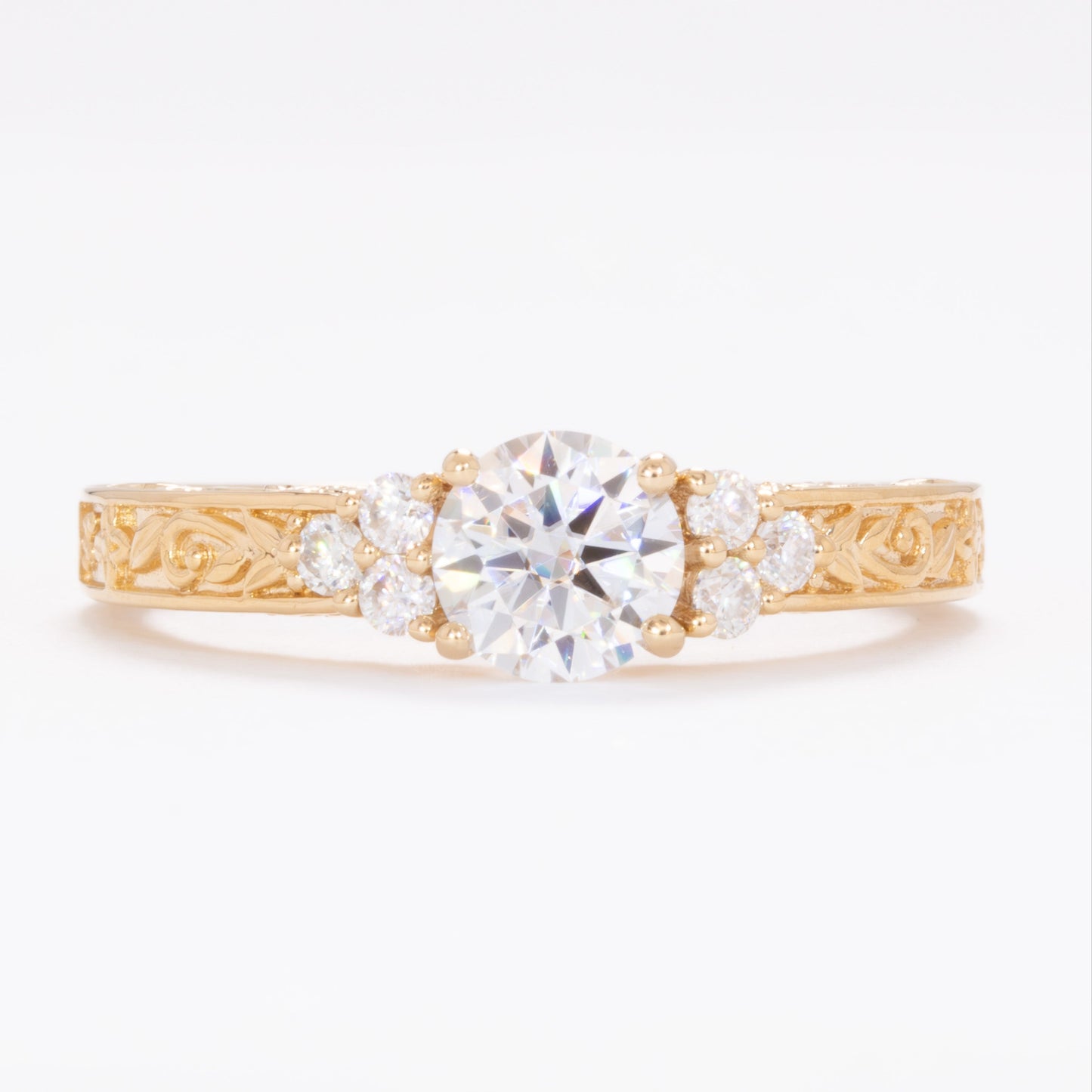 alice ring in yellow gold with round moissanite