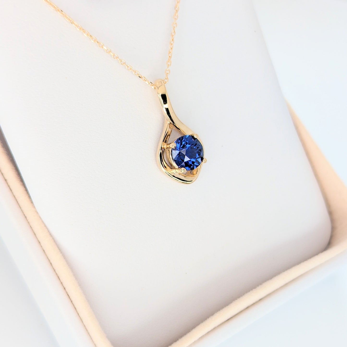 avery necklace in yellow gold with royal blue lab sapphire