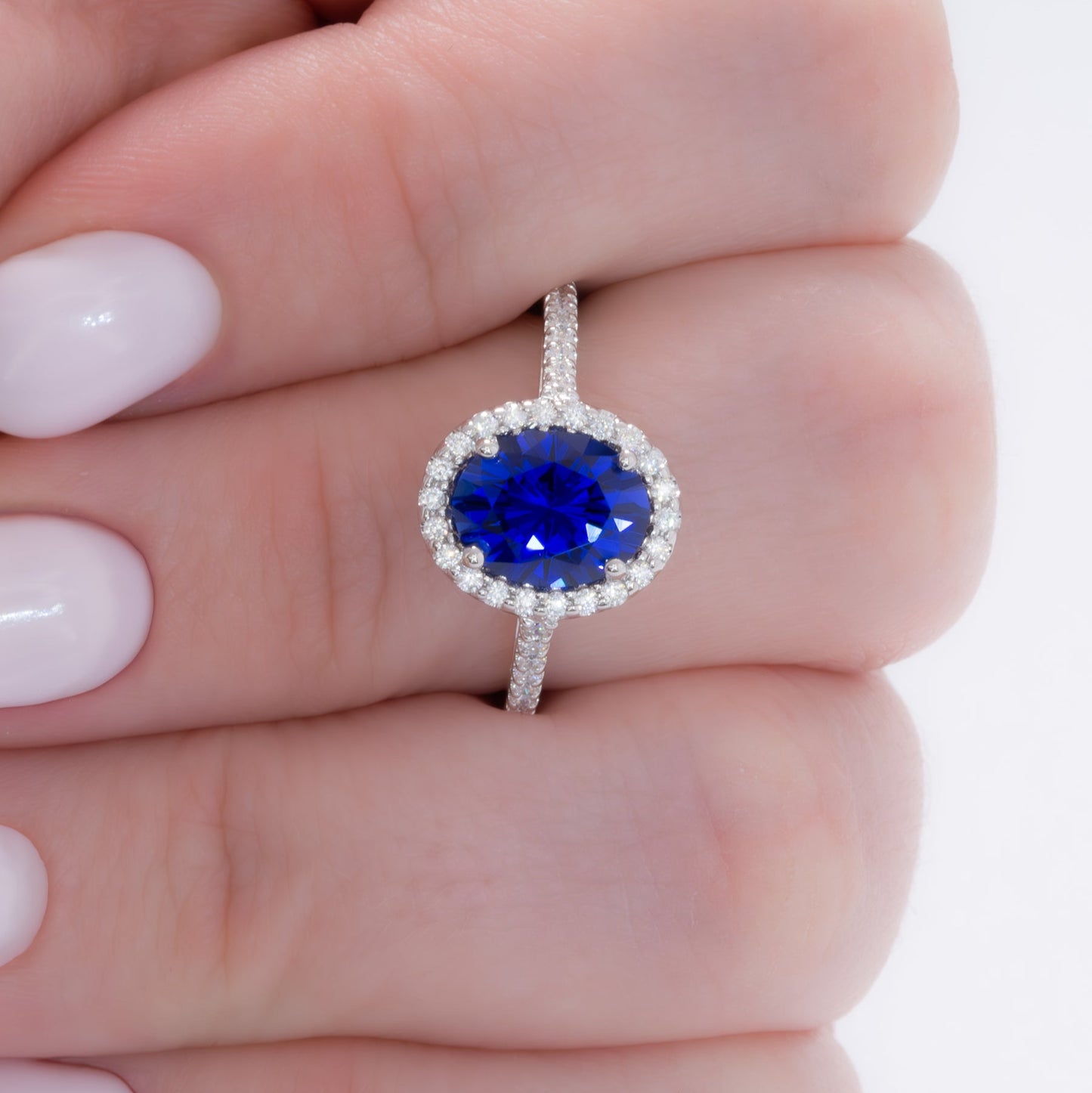 brynn halo engagement ring with royal blue oval lab sapphire