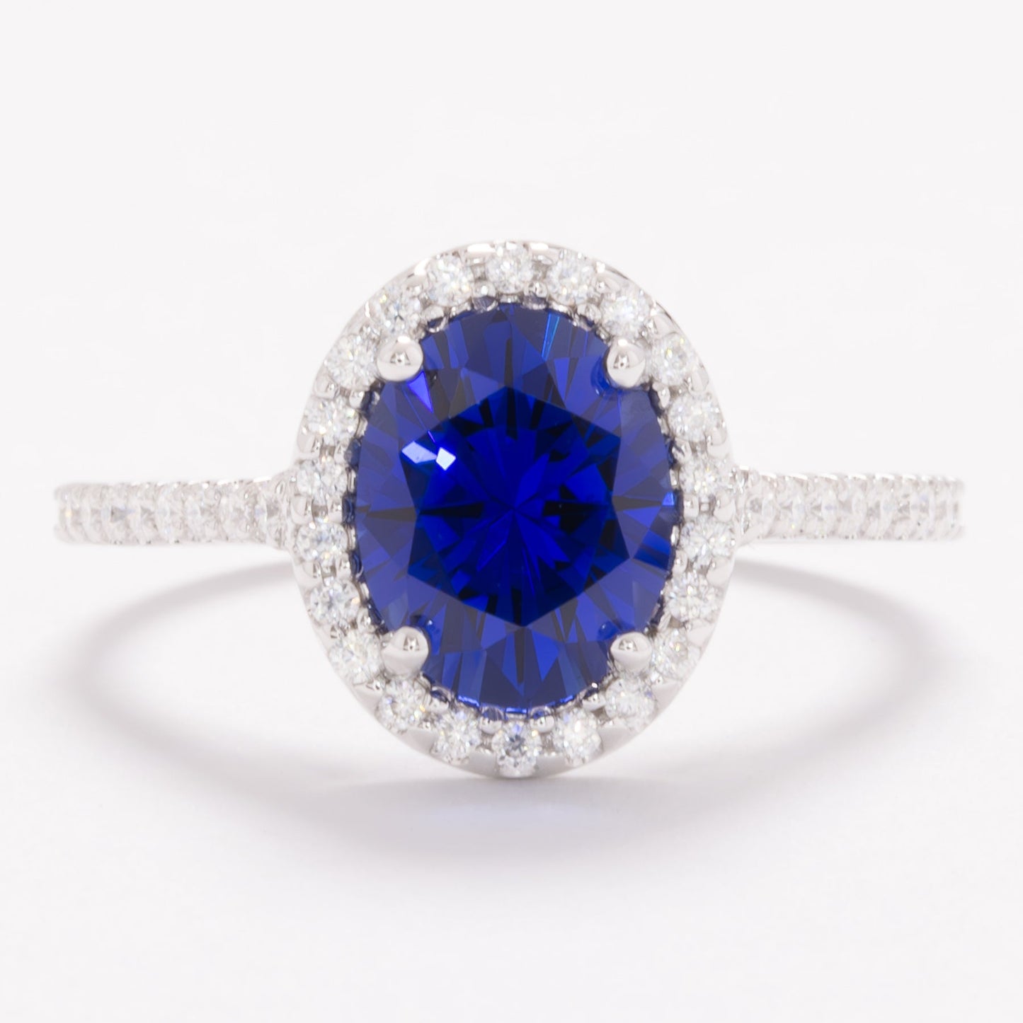 brynn halo engagement ring with royal blue oval lab sapphire