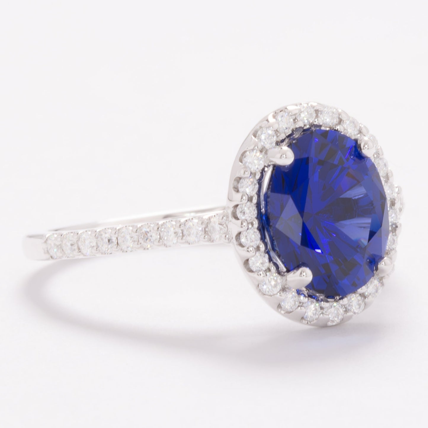 brynn halo engagement ring with royal blue oval lab sapphire