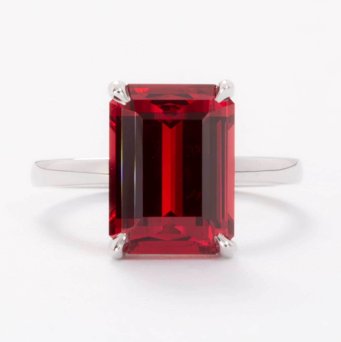cali solitaire ring with step cut lab ruby