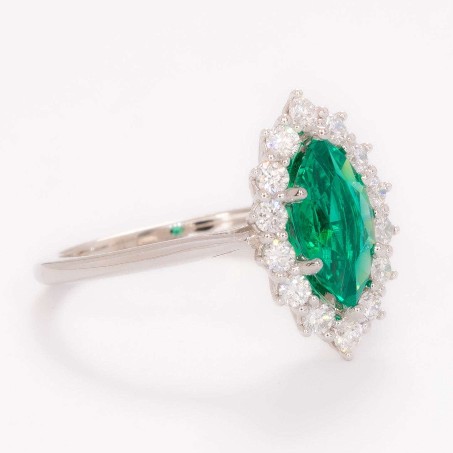 calypso halo engagement ring in white gold and marquise lab emerald