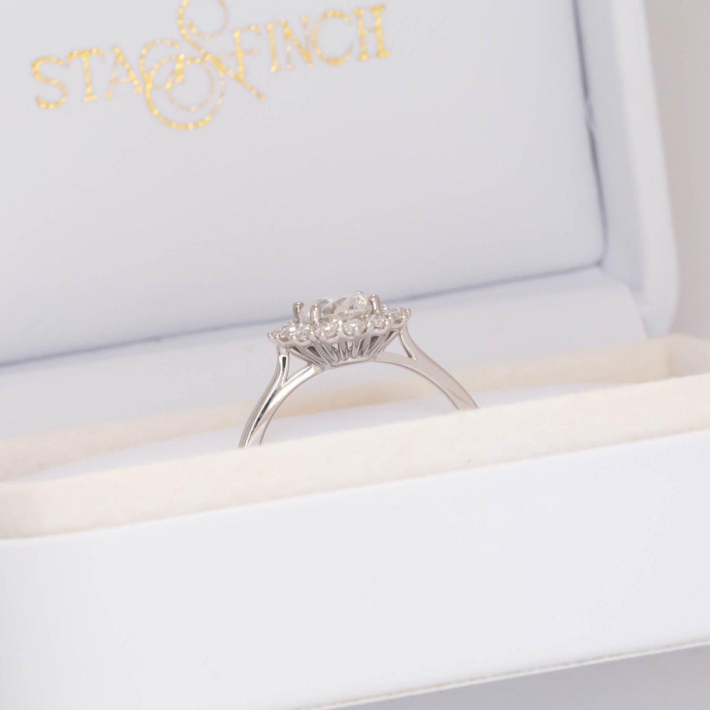 calypso halo engagement ring with white moissanite