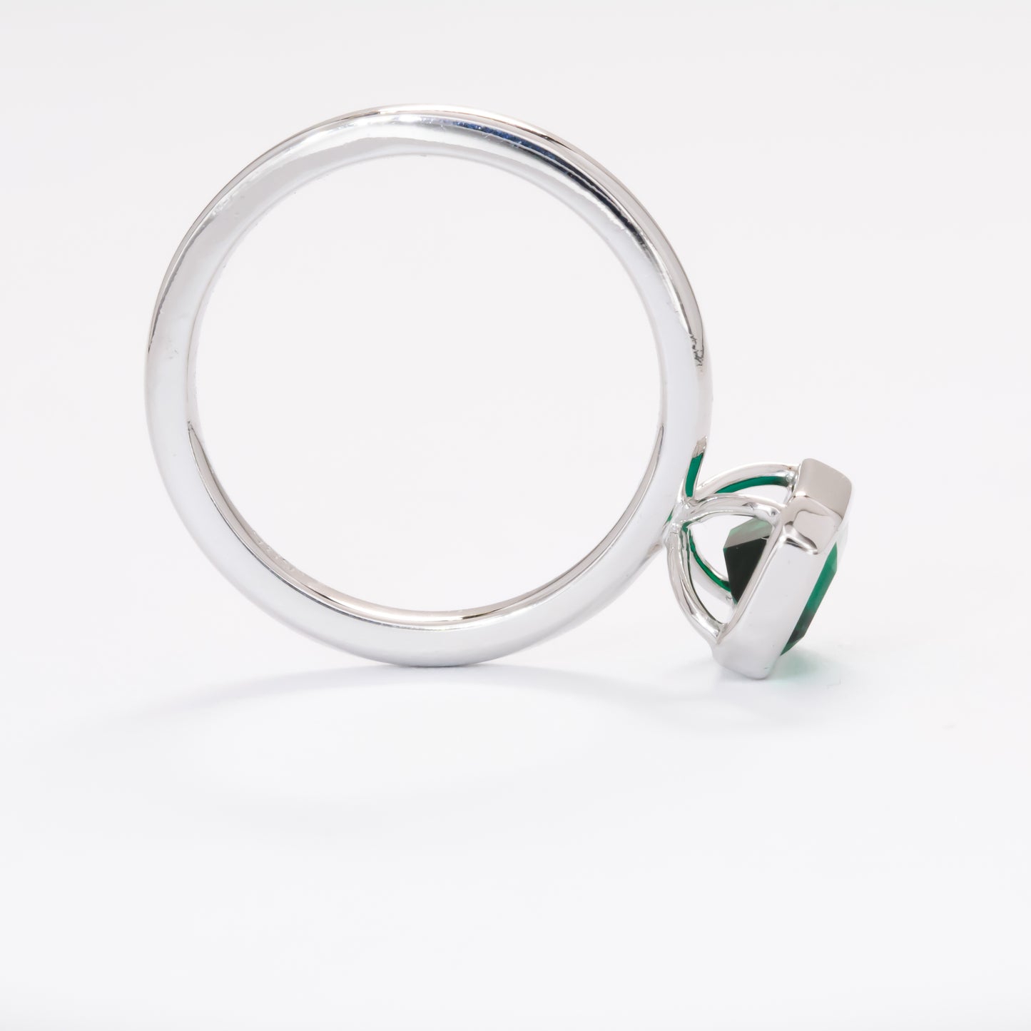cami engagement ring with lab emerald step cut
