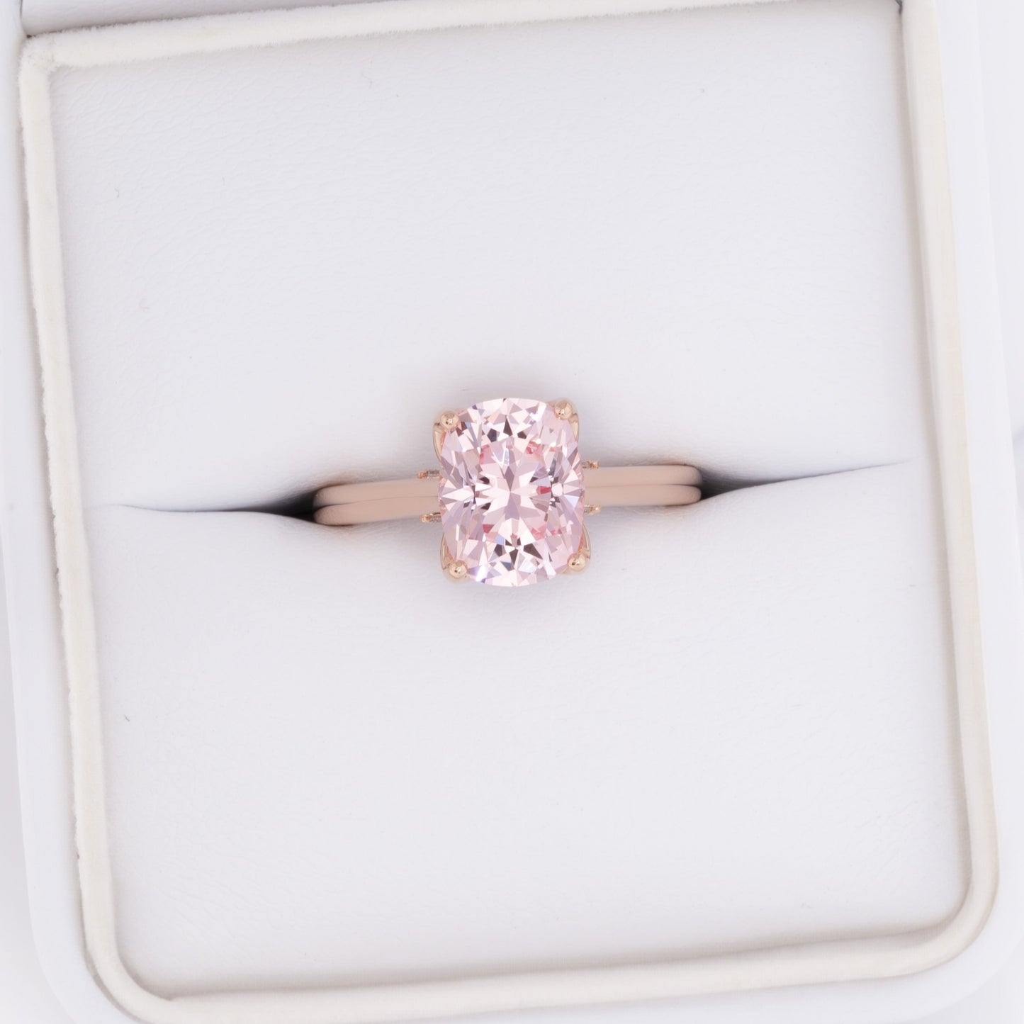 clover floral inspired engagement ring with peach lab sapphire