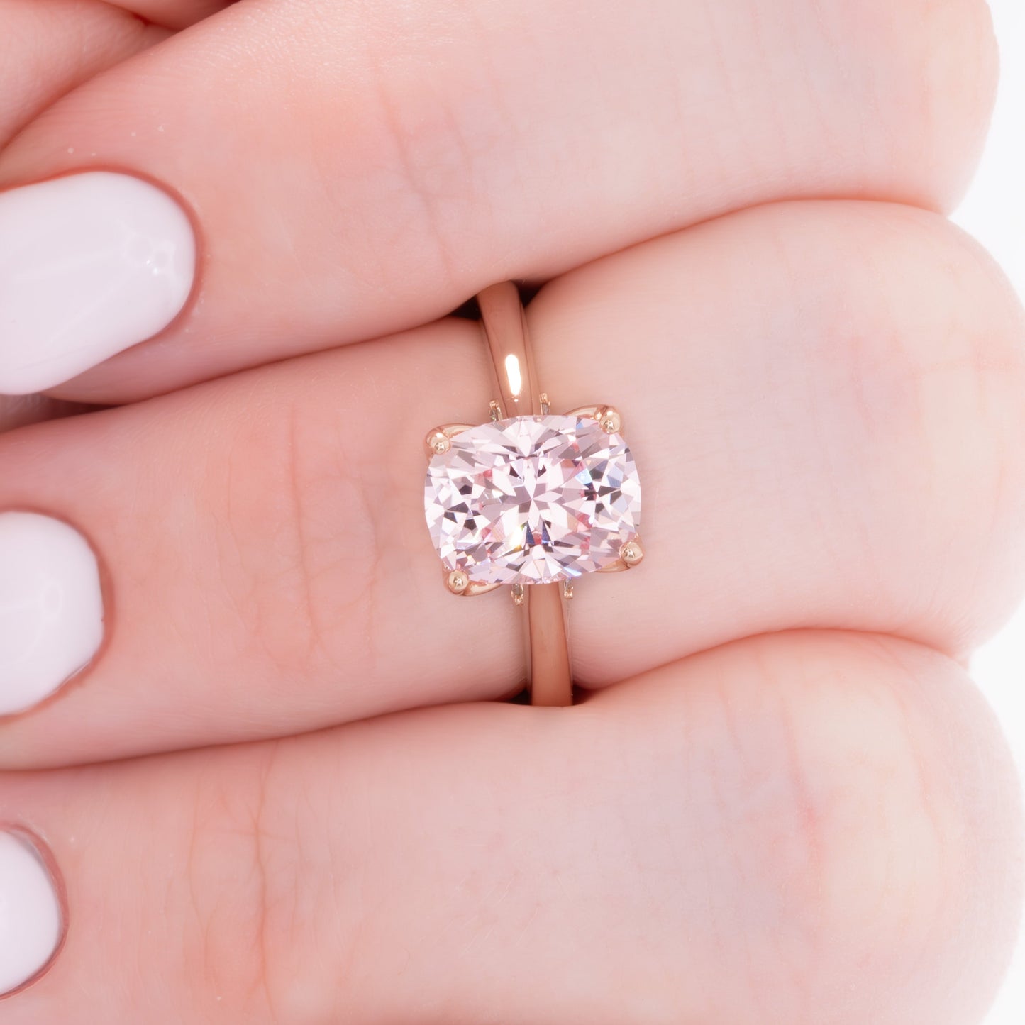 clover floral inspired engagement ring with peach lab sapphire